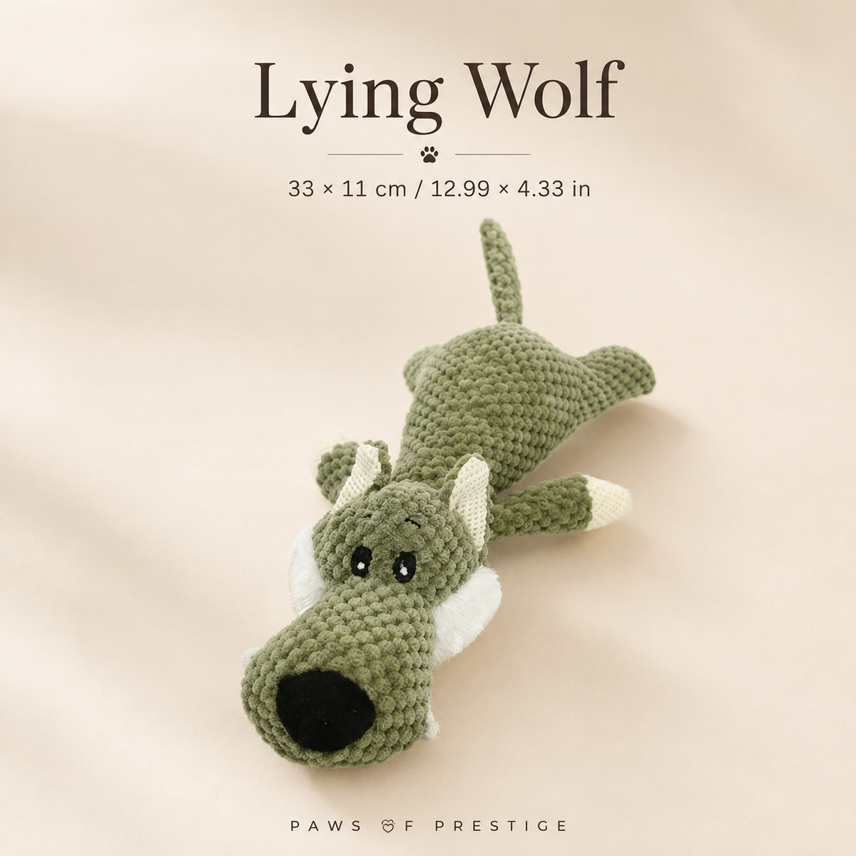 Lying Wolf plush squeaky dog toy on a soft ivory background with approximate size shown in centimeters and inches.