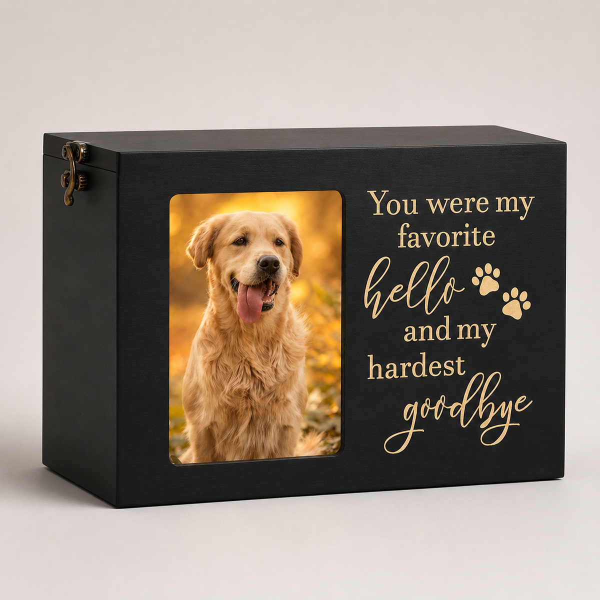 Black wooden pet memorial box with photo frame window and engraved quote on a clean studio background.