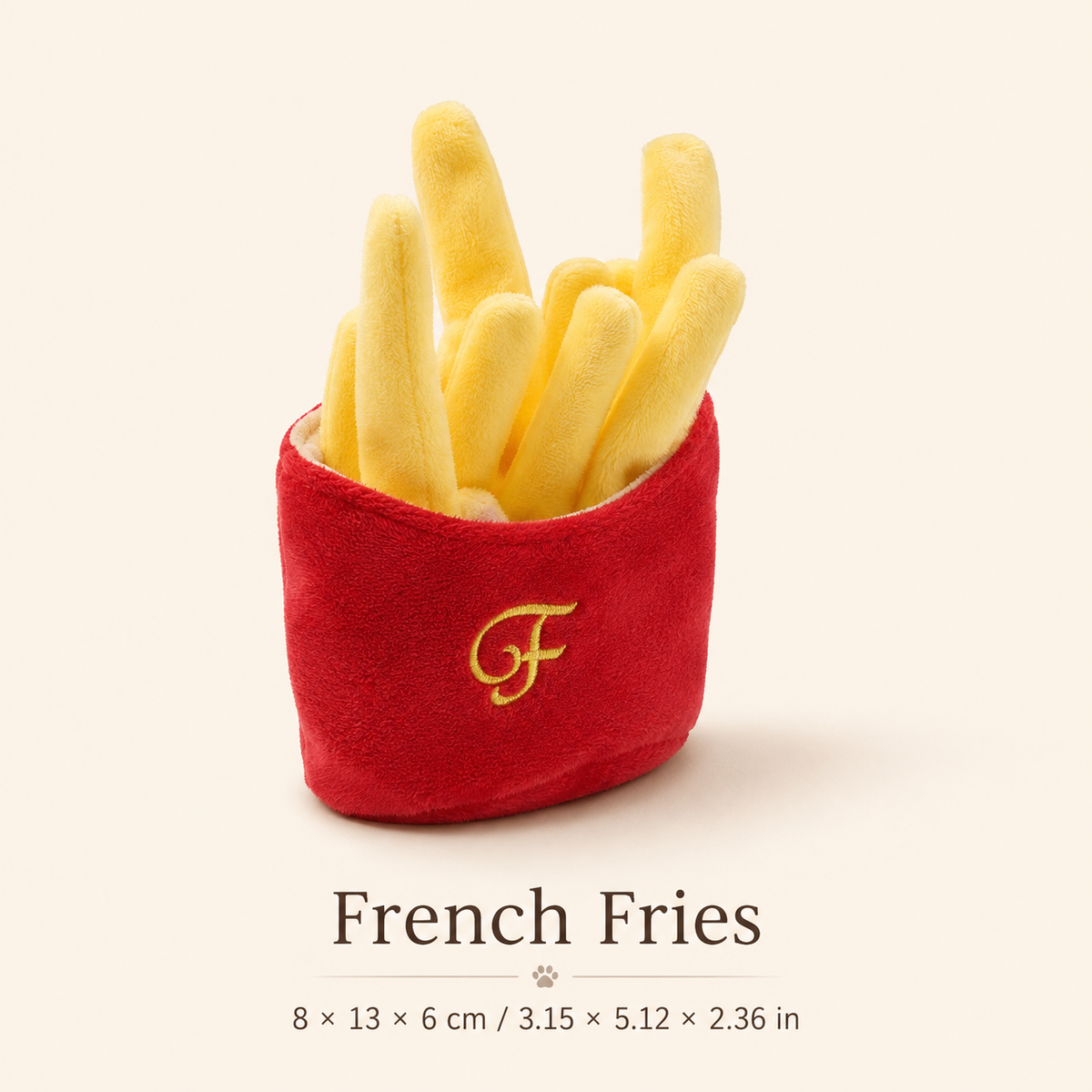 French fries plush squeaky dog toy in a red pouch displayed on a refined cream background with measurements in centimeters and inches.