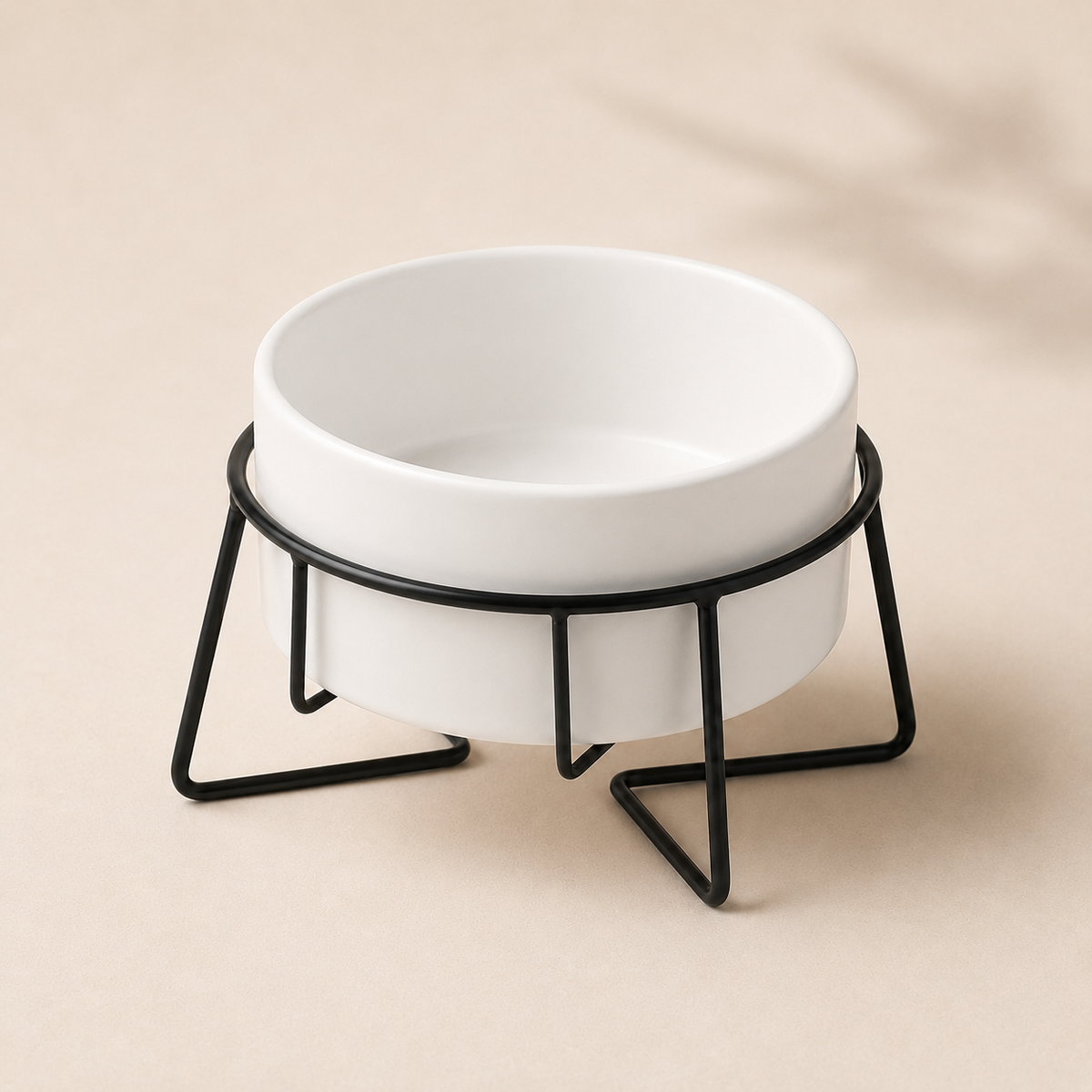 Elevated white ceramic pet bowl in a black metal stand with a minimalist luxury look.