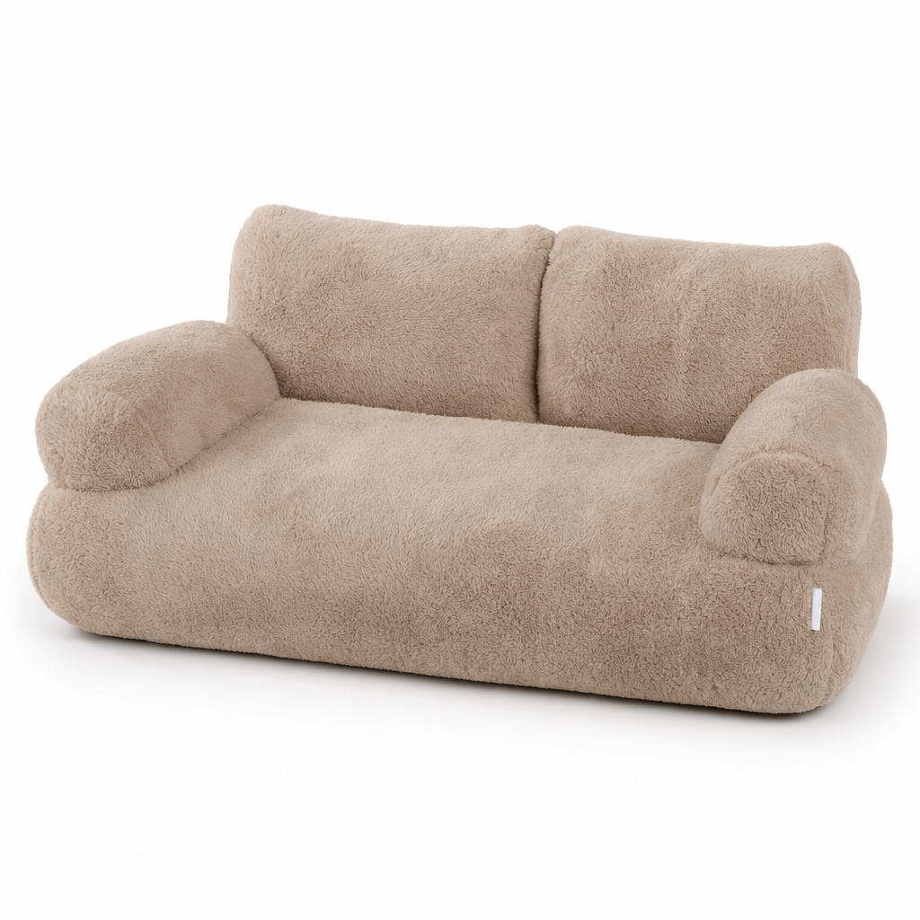 Latte plush cat bed shaped like a small sofa, with a two-part backrest and two rounded armrests.