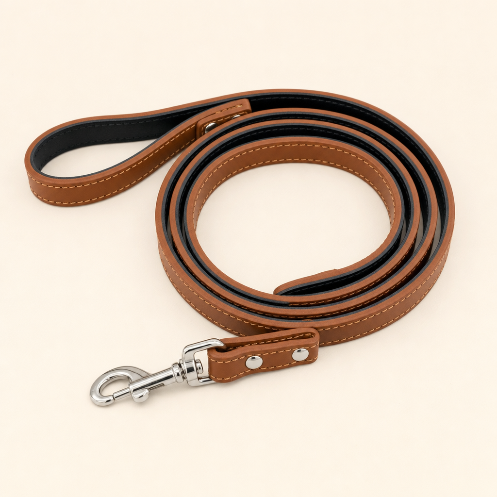 Plain cognac matching lead coiled flat, with a silver swivel hook and no rhinestones