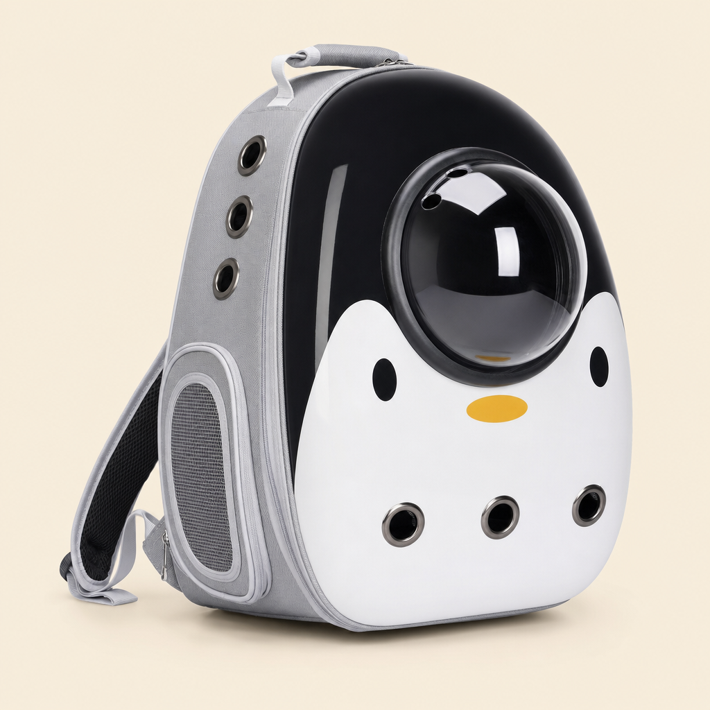 The carrier in Space Hood Penguin — a white and black penguin design with a yellow beak and the bubble dome set in the black head.