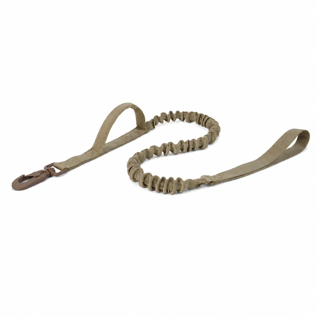Khaki dog lead with a brown snap hook, a grip handle near the hook, an elasticated bungee section and a hand loop.