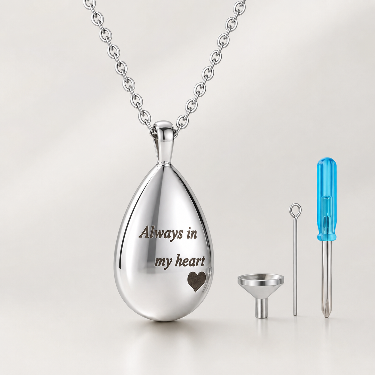 Silver memorial urn pendant necklace engraved “Always in my heart” with filling tools