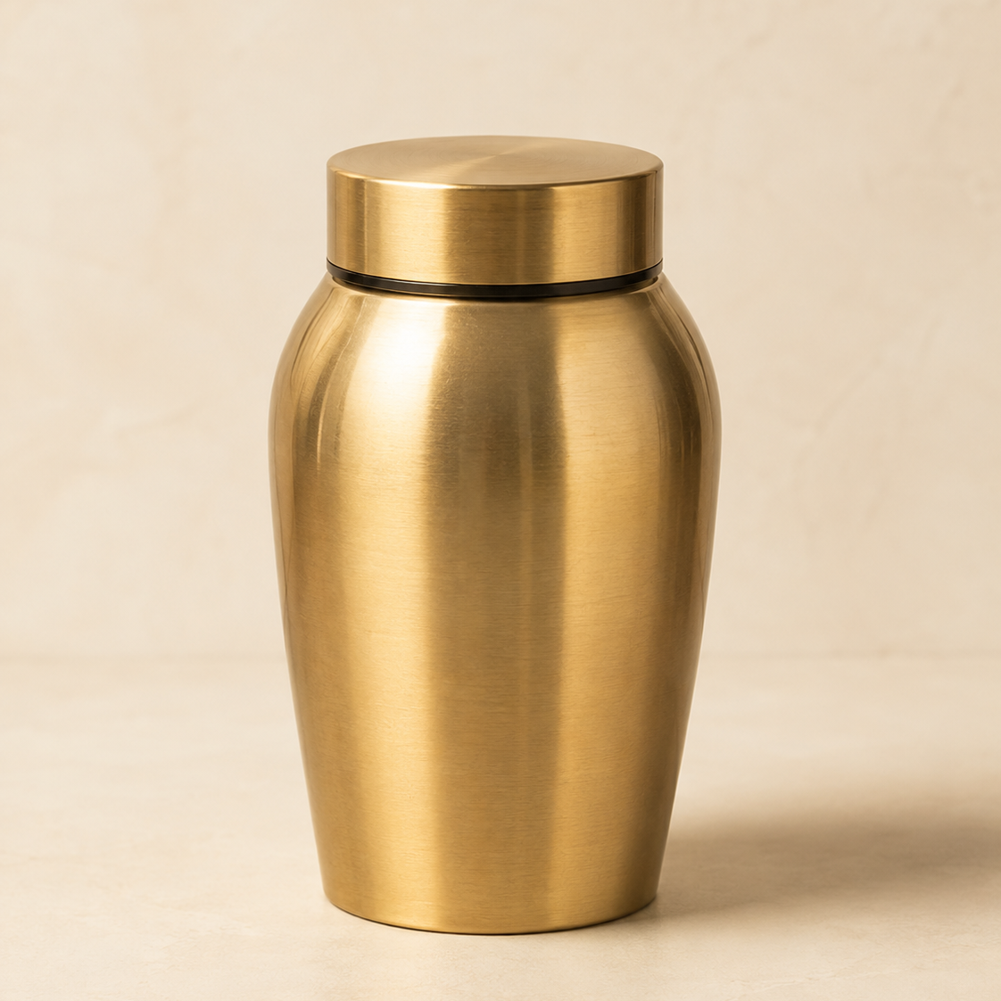 Front studio view of the Eternal Grace stainless steel pet memorial urn on a warm neutral background.