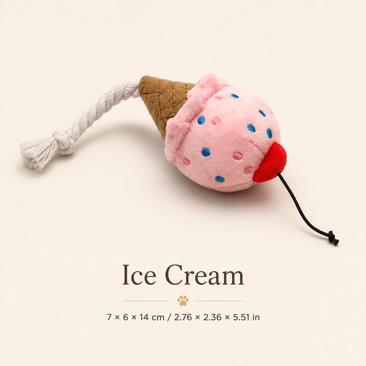 Ice cream plush squeaky dog toy with rope detail and cone base displayed on a warm ivory background with size information in centimeters and inches.