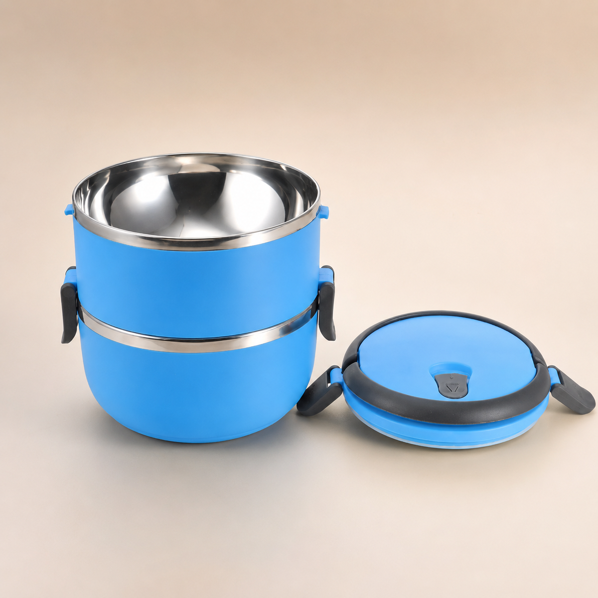 Studio product photo of the blue Voyager Seal stainless steel pet travel bowl showing the stainless interior and sealed lid.
