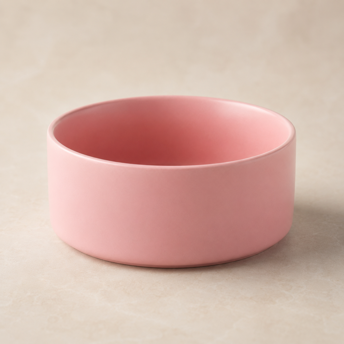 Pink ceramic pet bowl without stand shown in a minimal studio product shot.