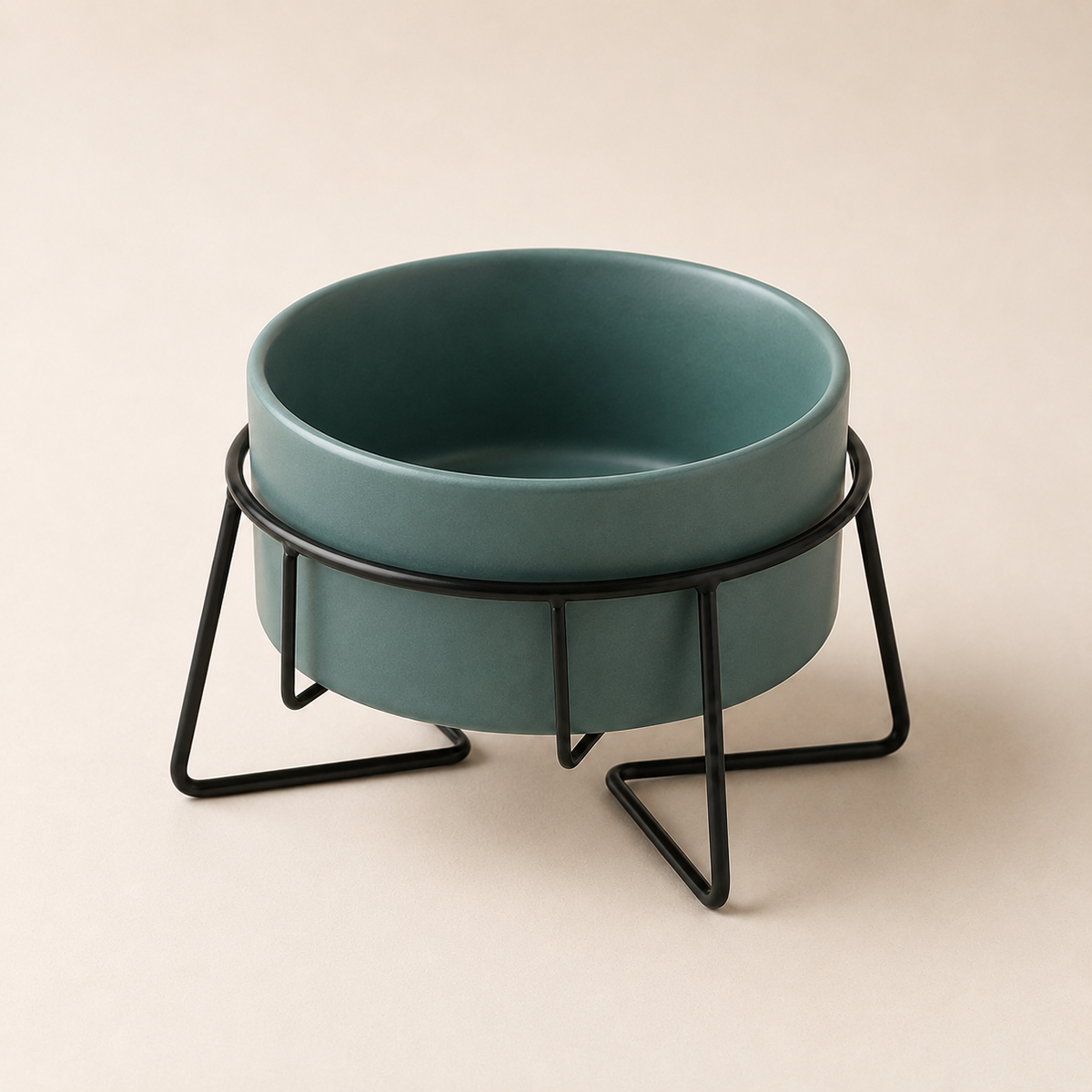 Elevated green ceramic pet bowl in a black metal stand on a refined studio background.