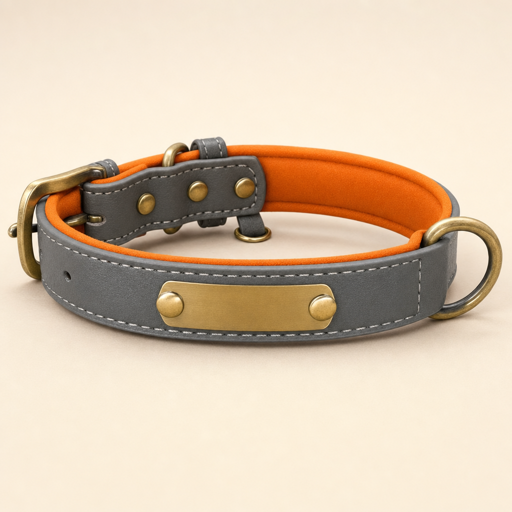 Slate grey vegan leather dog collar with orange padded lining and a blank ID plate