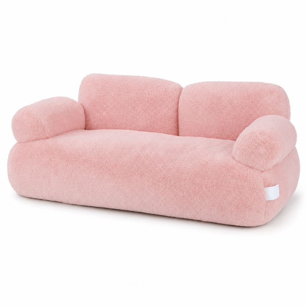 Pink plush cat bed shaped like a small sofa, with a two-part backrest and two rounded armrests.