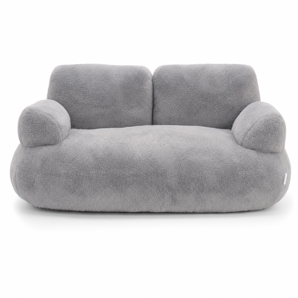 Grey plush cat bed shaped like a small sofa, with a two-part backrest and two rounded armrests.